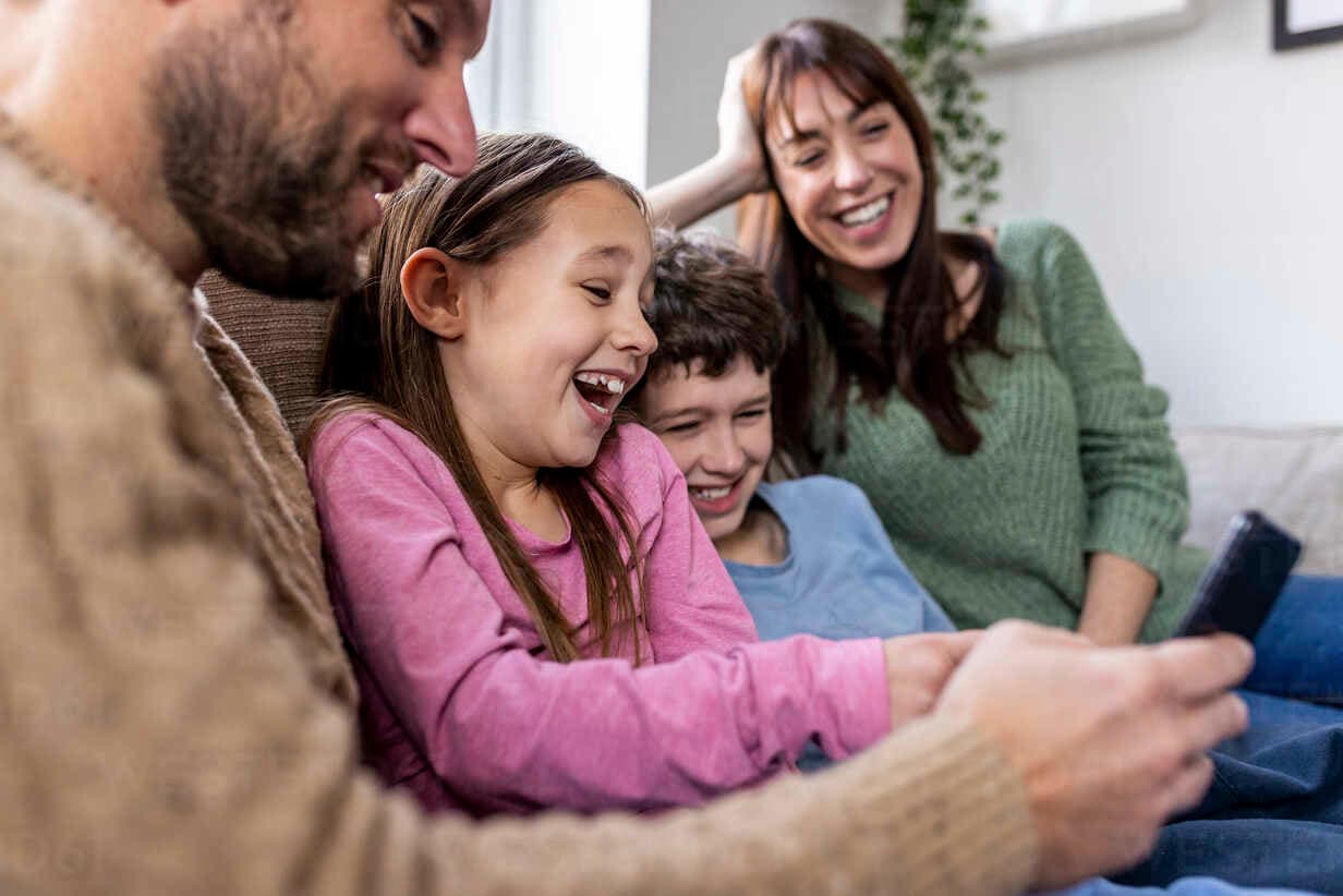 Happy family using technology together